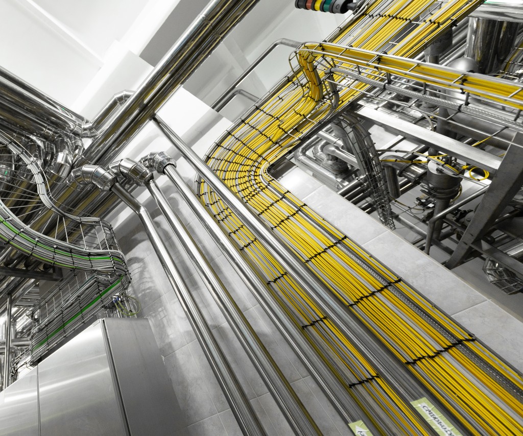 Cable tray and conduit runs installed with tidy segregation.